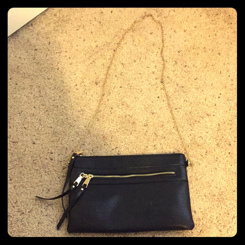 Black purse with gold linked strap